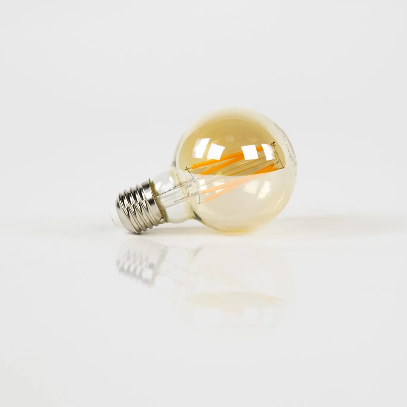 Lichtbron LED filament bol Ø7 / Amberkleurig glas